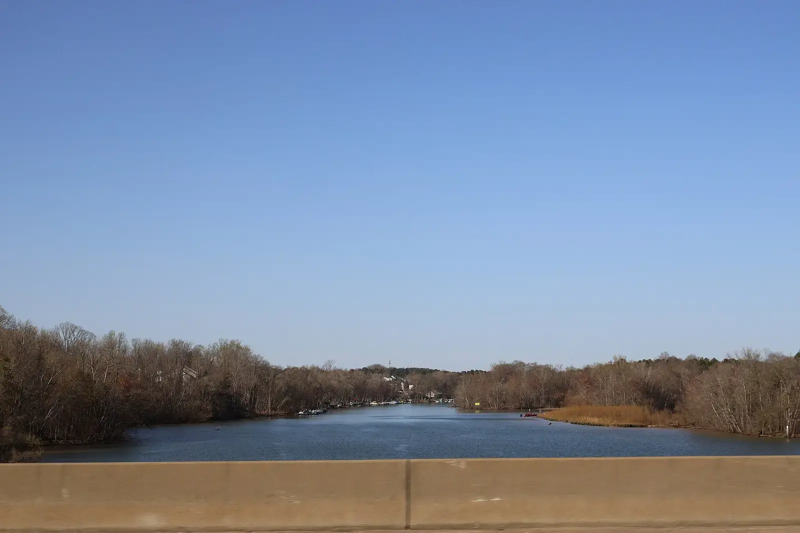 The Catawba River between wooded banks, seen from I-85 in Mecklenburg County
