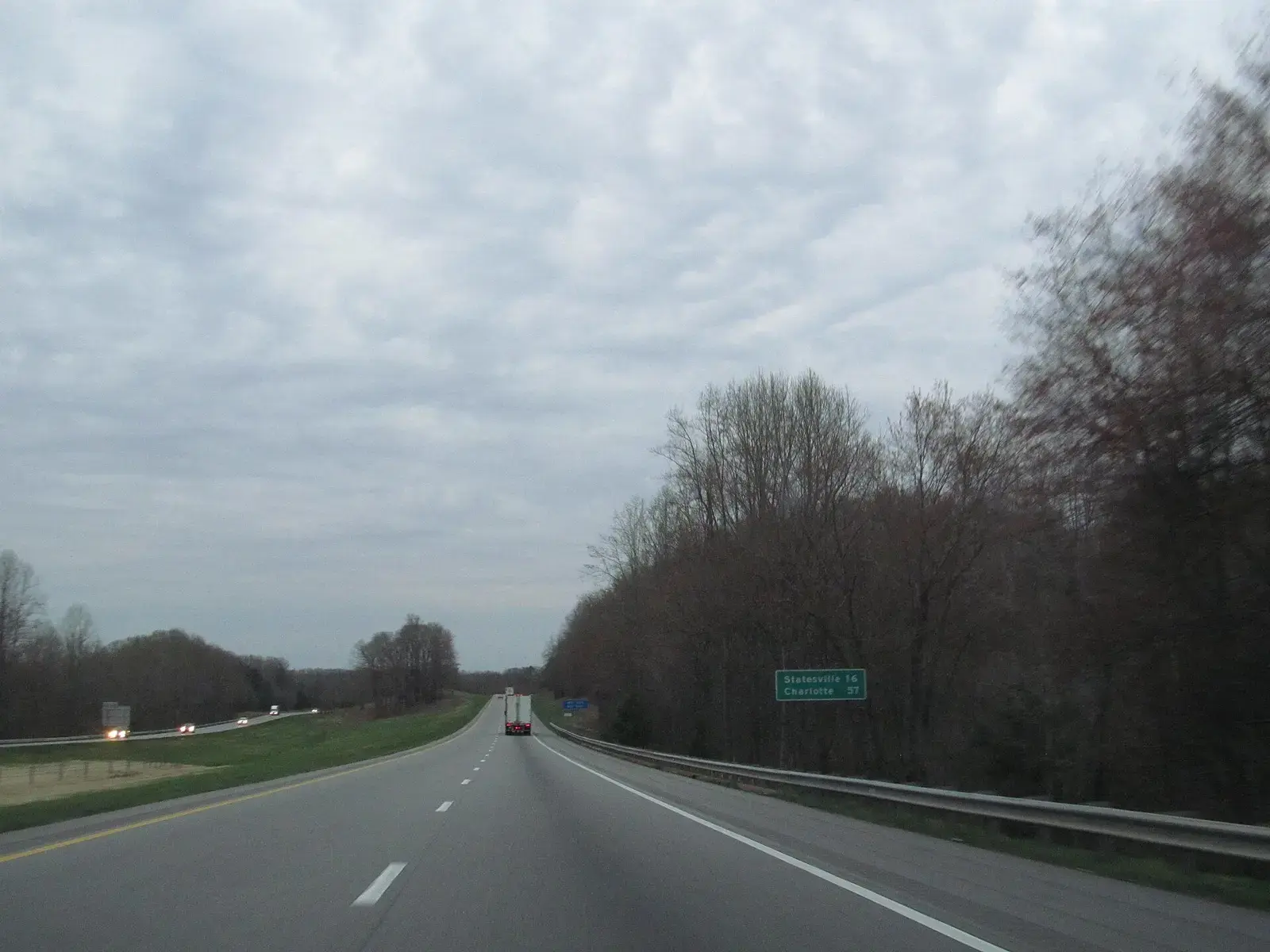 Interstate 77 stretching through wooded land in North Carolina