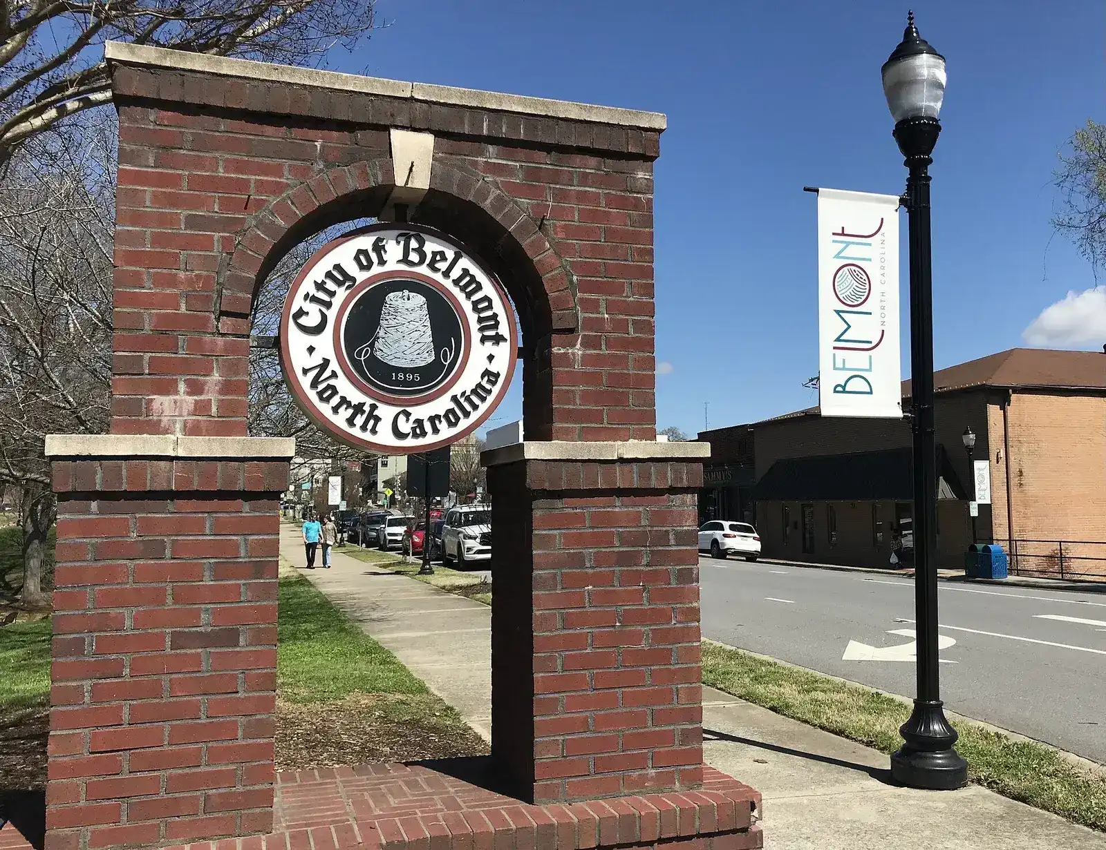 Brick arch with the City of Belmont seal and banners in downtown Belmont, North Carolina