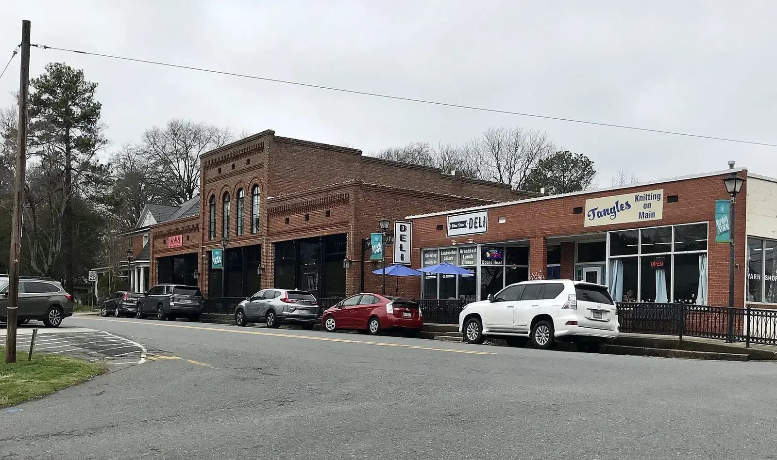 Brick storefronts at a quiet intersection in downtown Waxhaw, North Carolina
