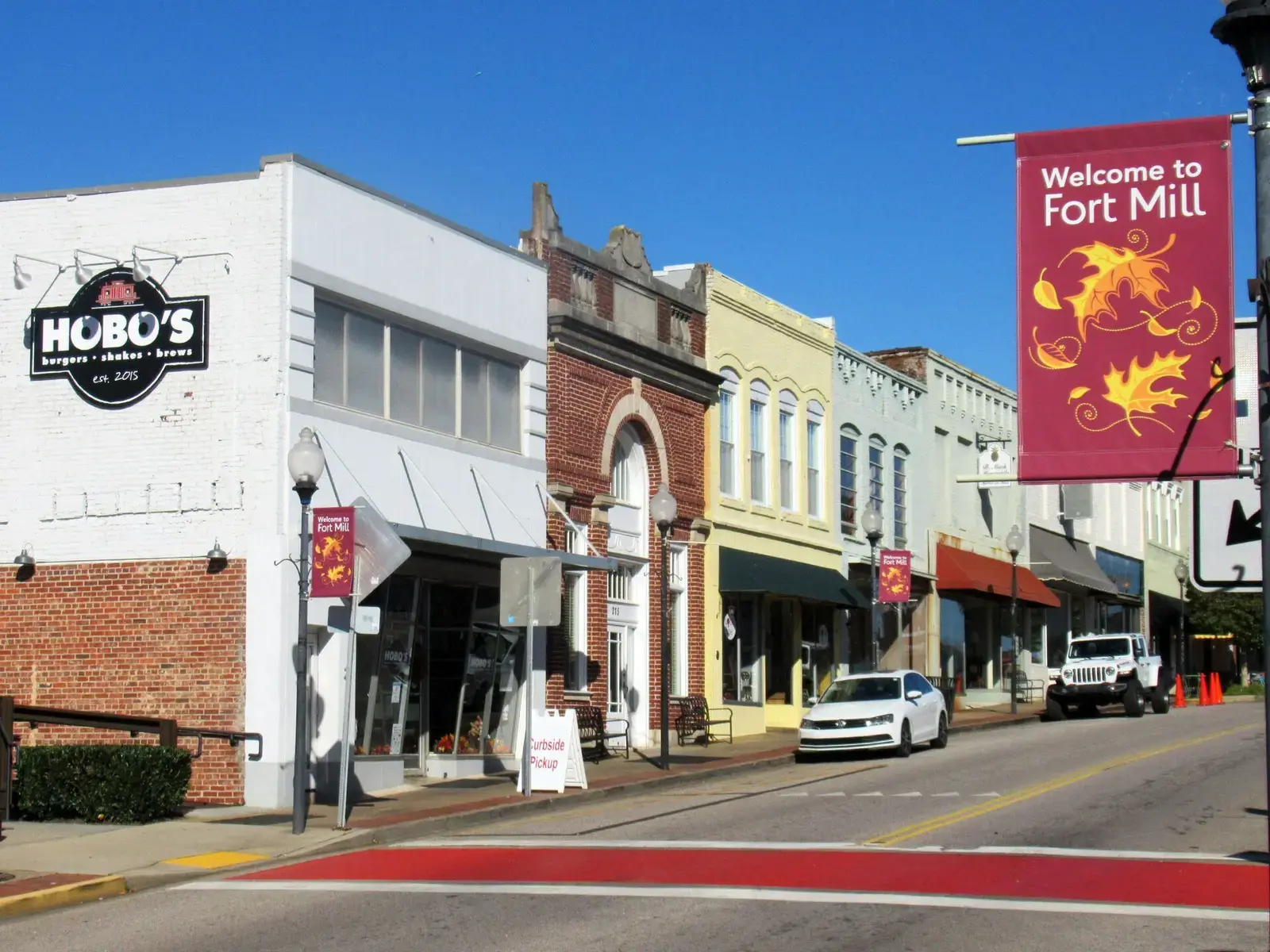 Storefronts and street banners along Main Street in downtown Fort Mill, South Carolina
