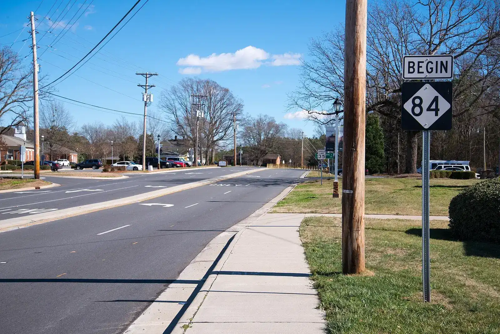 NC 84 route sign along a tree-lined road in Weddington, North Carolina