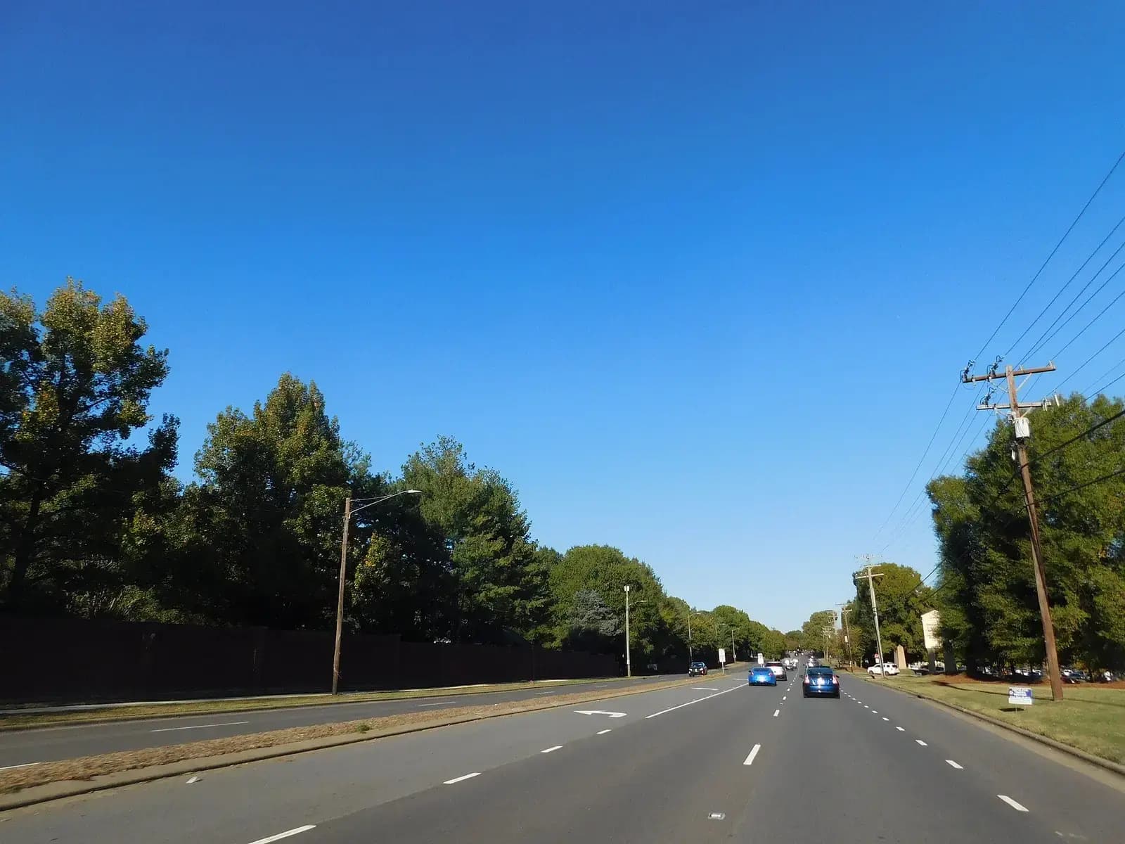 NC 51 running through tree-lined Matthews, North Carolina